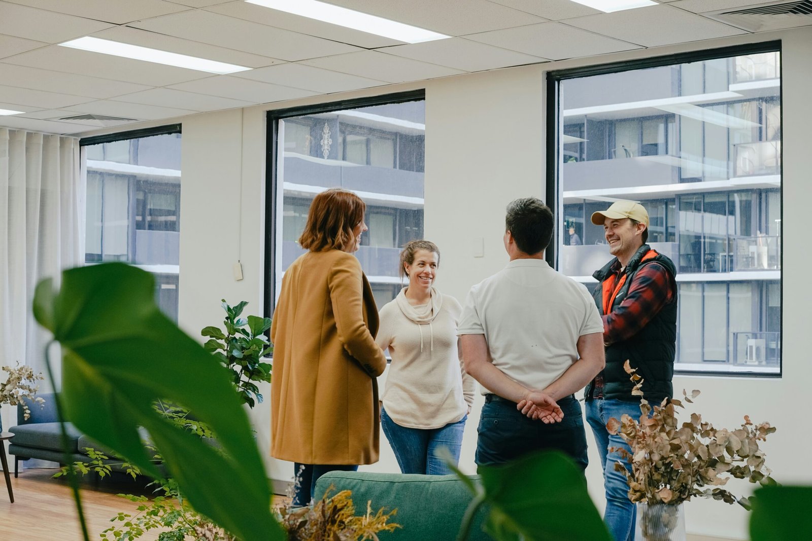 a group of people standing in an office